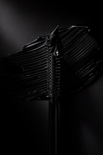 Black tubing mascara wraps around each eyelash. so no clumps