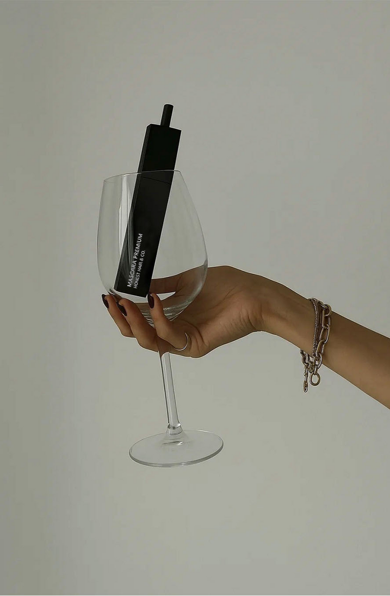 wine glass with a black mascara 
